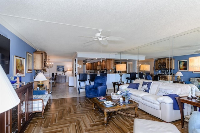 632 Edgewater Dr Unit 532, Dunedin, FL 34698 - living area with ceiling fan, a textured ceiling, and crown molding