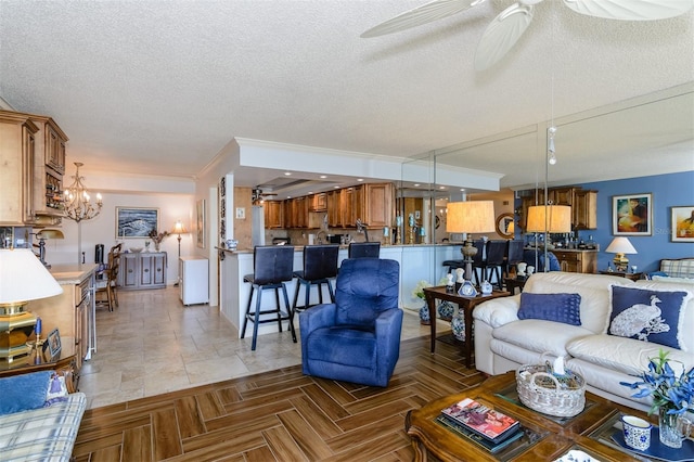 living room with ceiling fan with notable chandelier, crown molding, parquet flooring, and a textured ceiling