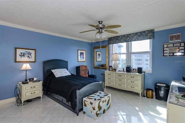 tiled bedroom featuring a textured ceiling, ceiling fan, and crown molding