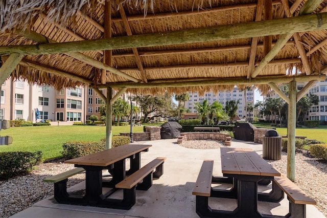 view of home's community with a gazebo, a yard, and a patio