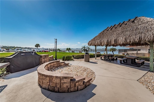 view of patio / terrace with a gazebo and a water view