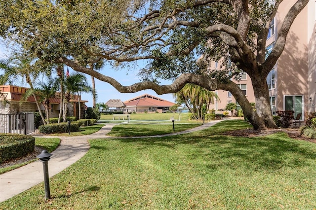 632 Edgewater Dr Unit 532, Dunedin, FL 34698 - surrounding community with a lawn and a residential view