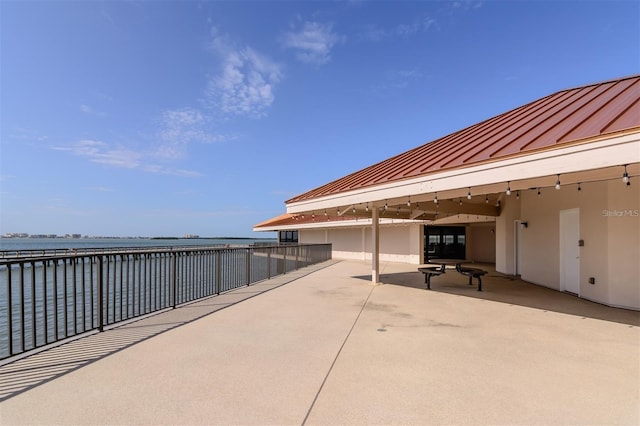 view of patio / terrace featuring a water view