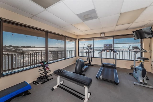 exercise room featuring a paneled ceiling