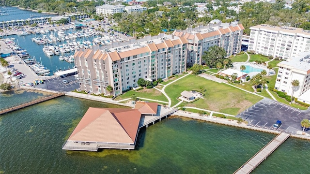632 Edgewater Dr Unit 532, Dunedin, FL 34698 - drone / aerial view of a nearby body of water, apartment complex / building, a marina, and a pool area