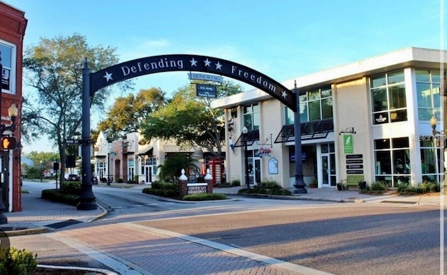 632 Edgewater Dr Unit 532, Dunedin, FL 34698 - view of asphalt road with sidewalks, curbs, and street lights