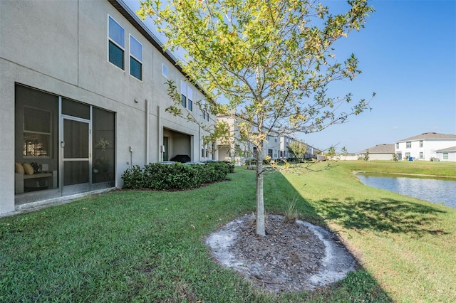 view of yard with a water view