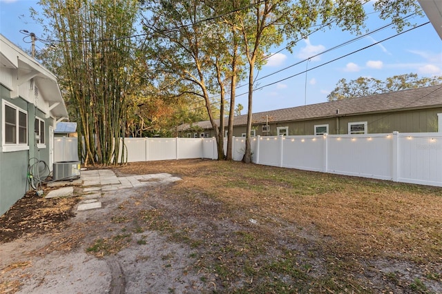 view of yard with central AC