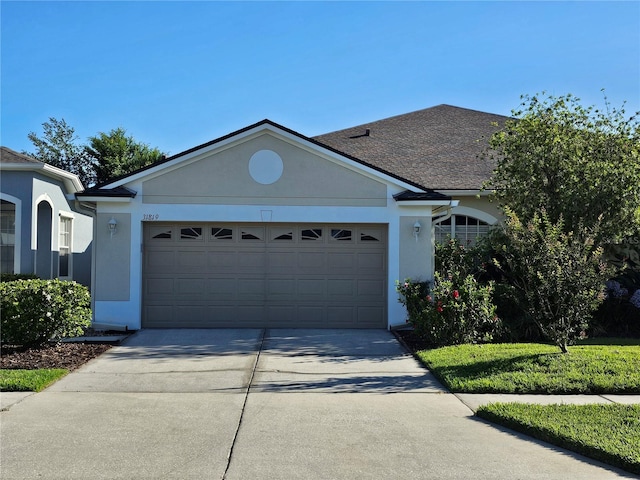 ranch-style house featuring a garage