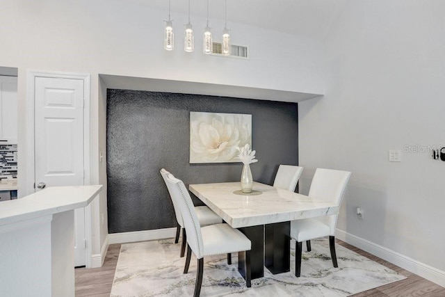 dining room with light hardwood / wood-style flooring