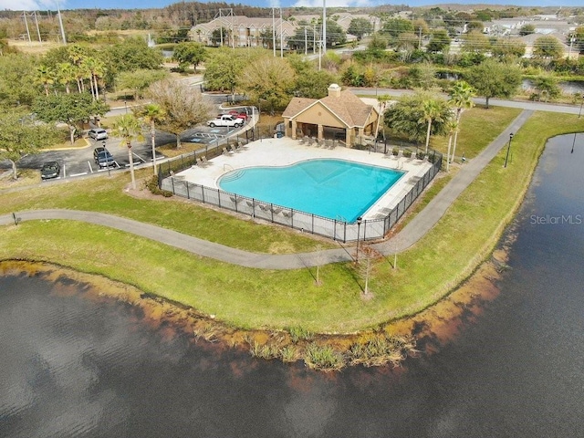 view of pool with a water view