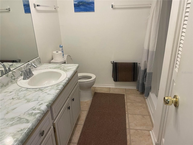 bathroom with vanity, a shower with shower curtain, and toilet