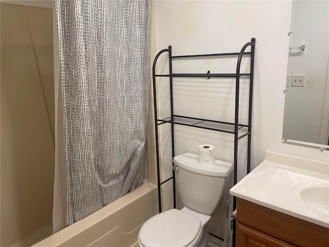 full bathroom featuring vanity, toilet, and shower / tub combo