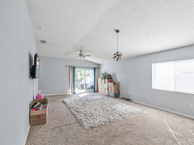 game room featuring carpet flooring, ceiling fan, a textured ceiling, and vaulted ceiling