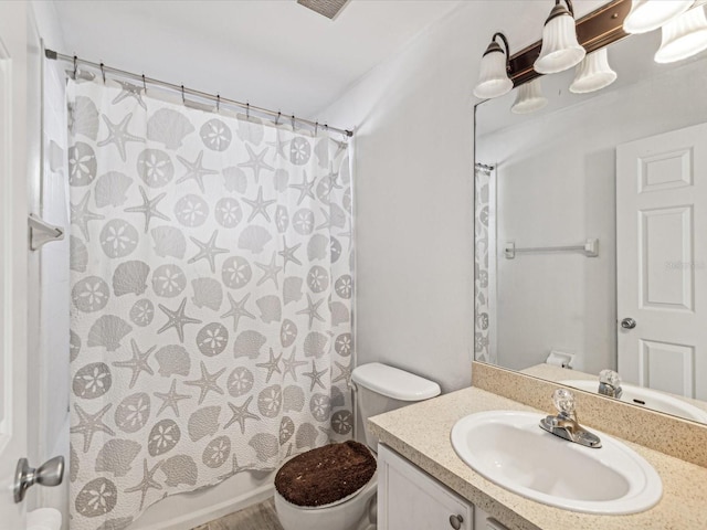 full bathroom featuring vanity, toilet, and shower / tub combo