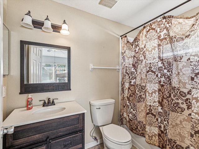 full bathroom with vanity, shower / bath combination with curtain, and toilet