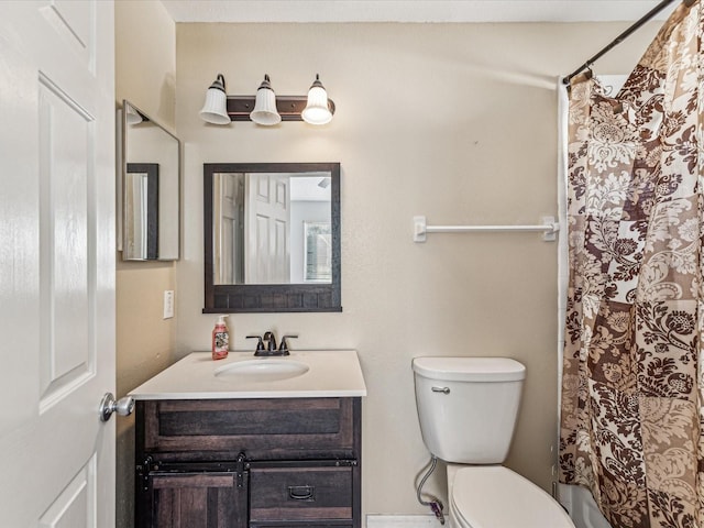 full bathroom featuring shower / bath combination with curtain, vanity, and toilet