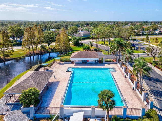 view of swimming pool with a water view