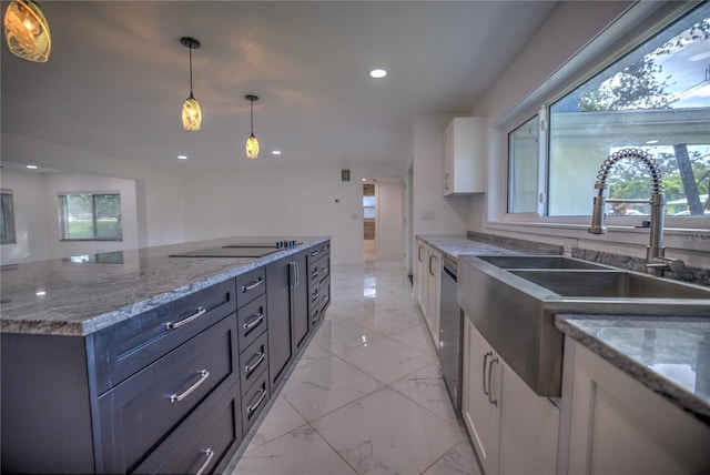 kitchen featuring black electric stovetop, sink, decorative light fixtures, dishwasher, and white cabinetry