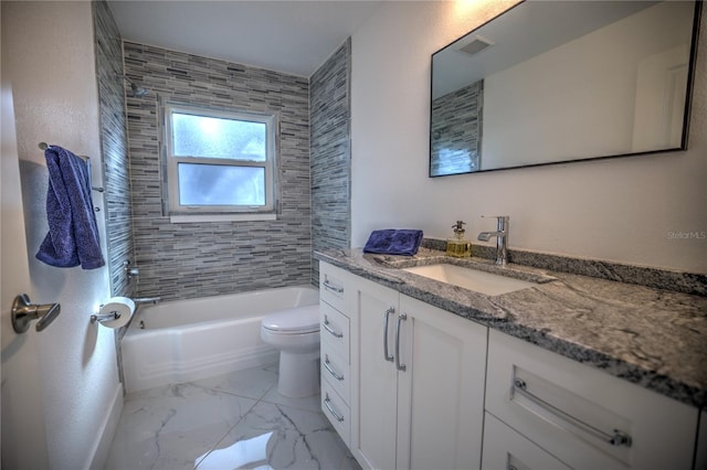 full bathroom with vanity, toilet, and tiled shower / bath combo