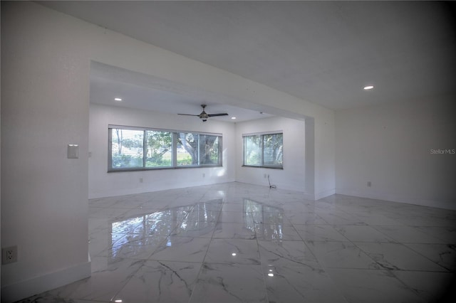 1042 Idlewild Dr N, Dunedin, FL 34698 - empty room featuring marble look tiles, baseboards, recessed lighting, and a ceiling fan