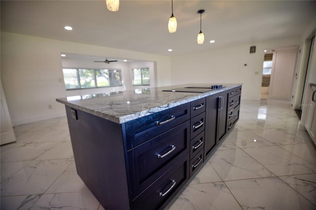 kitchen featuring light stone countertops, ceiling fan, pendant lighting, black electric stovetop, and a kitchen island