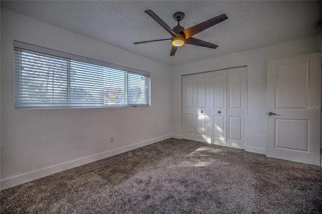 unfurnished bedroom featuring carpet, ceiling fan, and a closet