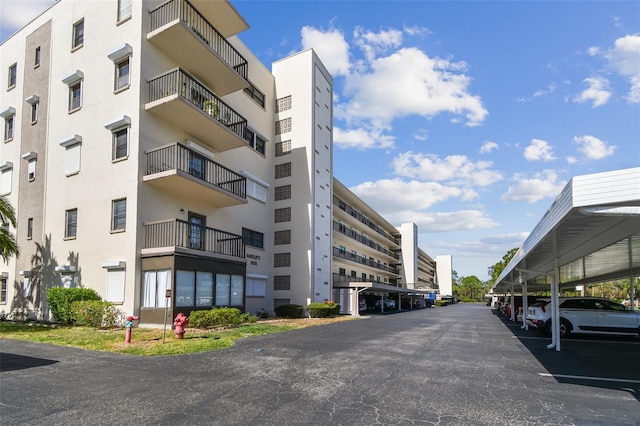 8198 Terrace Garden Dr N Unit 403, Saint Petersburg, FL 33709 - view of apartment building / complex with covered parking