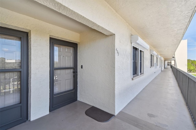 8198 Terrace Garden Dr N Unit 403, Saint Petersburg, FL 33709 - entrance to property featuring stucco siding and a balcony