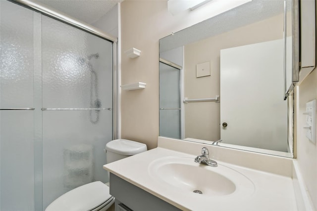 8198 Terrace Garden Dr N Unit 403, Saint Petersburg, FL 33709 - bathroom with a shower with shower door, vanity, and toilet