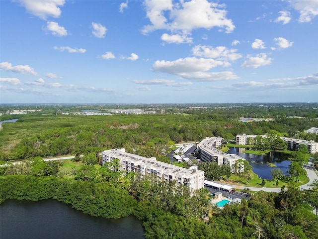 8198 Terrace Garden Dr N Unit 403, Saint Petersburg, FL 33709 - drone / aerial view of apartment complex, a nearby body of water, and a forest
