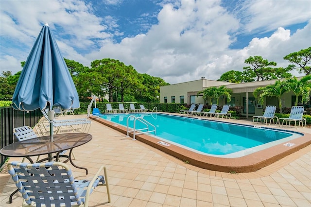 view of pool featuring a patio