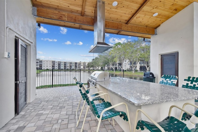 8198 Terrace Garden Dr N Unit 403, Saint Petersburg, FL 33709 - view of patio featuring a water view