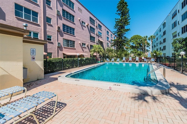 view of swimming pool with a patio area