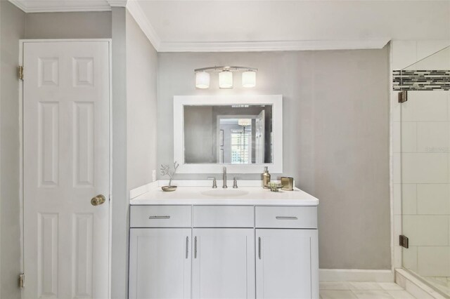 345 Bayshore Blvd Unit 808, Tampa, FL 33606 - bathroom with vanity, a shower stall, crown molding, and baseboards