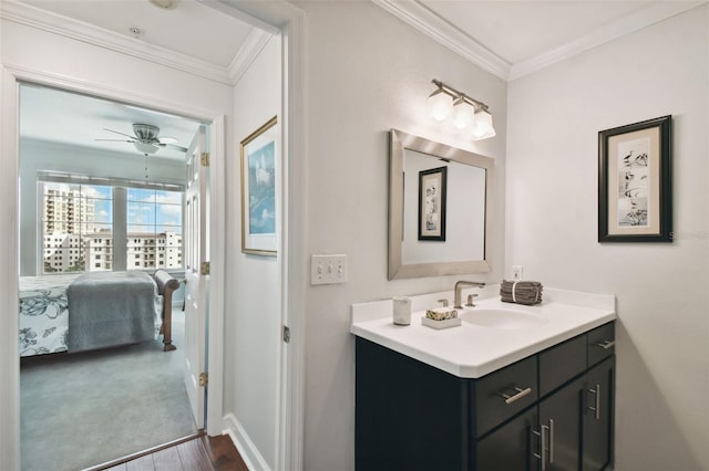 345 Bayshore Blvd Unit 808, Tampa, FL 33606 - ensuite bathroom featuring vanity, wood finished floors, crown molding, baseboards, and a ceiling fan