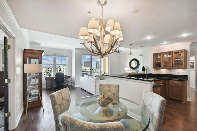 345 Bayshore Blvd Unit 808, Tampa, FL 33606 - dining room featuring a chandelier, dark wood-style floors, ornamental molding, recessed lighting, and baseboards