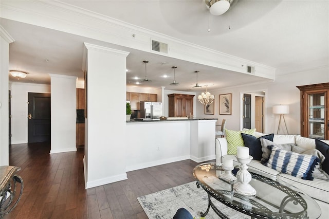 345 Bayshore Blvd Unit 808, Tampa, FL 33606 - living room featuring ceiling fan, dark wood-style flooring, ornamental molding, and baseboards