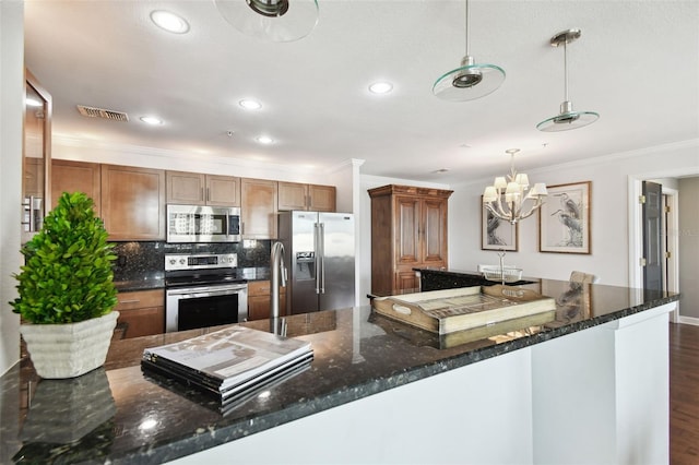 345 Bayshore Blvd Unit 808, Tampa, FL 33606 - kitchen with stainless steel appliances, ornamental molding, recessed lighting, tasteful backsplash, and dark wood finished floors