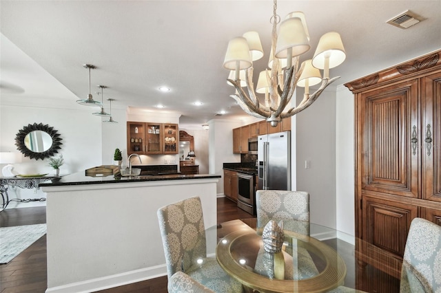 345 Bayshore Blvd Unit 808, Tampa, FL 33606 - dining room with recessed lighting, crown molding, dark wood-style flooring, a chandelier, and baseboards
