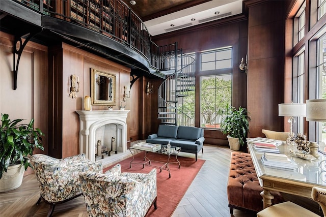 345 Bayshore Blvd Unit 808, Tampa, FL 33606 - living room featuring stairway, a towering ceiling, a fireplace with raised hearth, and plenty of natural light