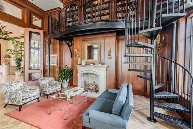 345 Bayshore Blvd Unit 808, Tampa, FL 33606 - living area featuring stairway, wood walls, and a fireplace