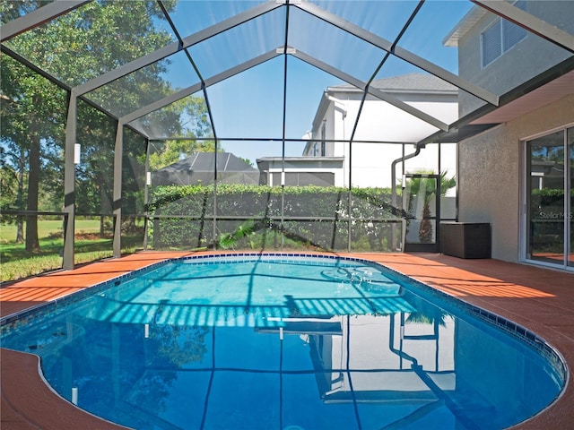 view of swimming pool with a lanai