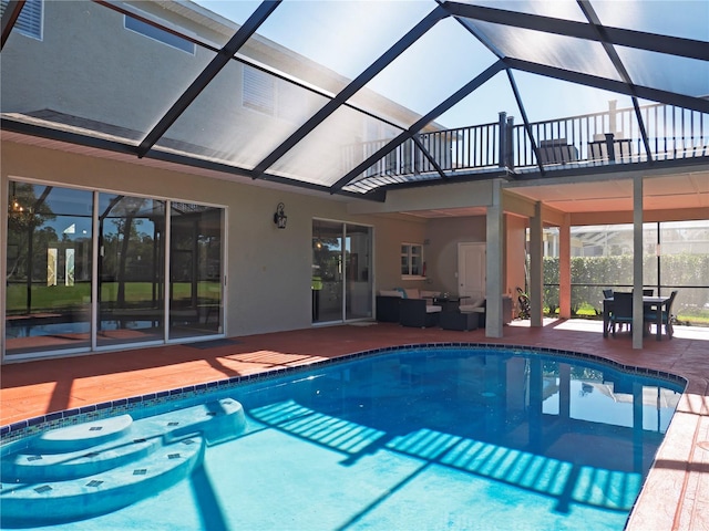 view of pool featuring outdoor lounge area, a lanai, and a patio area