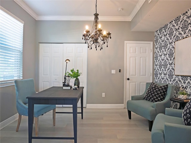 office space with light hardwood / wood-style floors, crown molding, and an inviting chandelier