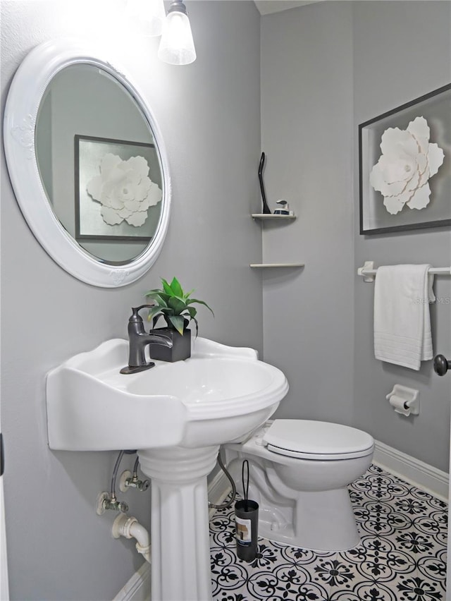 bathroom featuring tile patterned floors and toilet