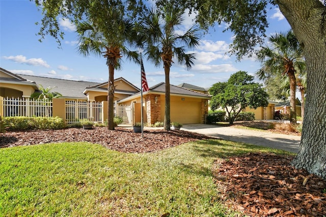 ranch-style home featuring a garage and a front lawn