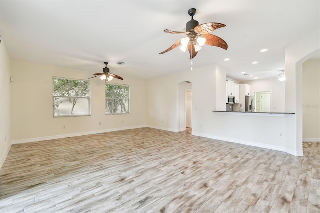 unfurnished living room with light hardwood / wood-style flooring