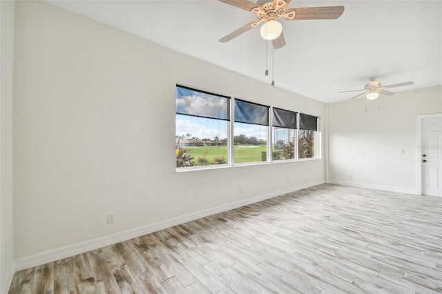 spare room with light hardwood / wood-style floors and ceiling fan