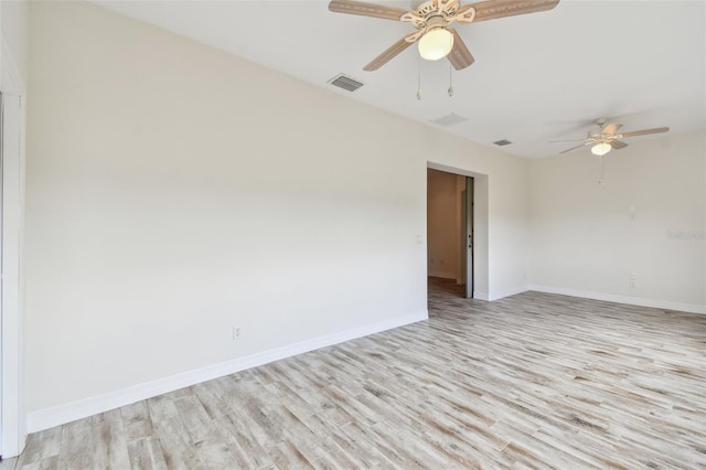 unfurnished room with ceiling fan and light wood-type flooring